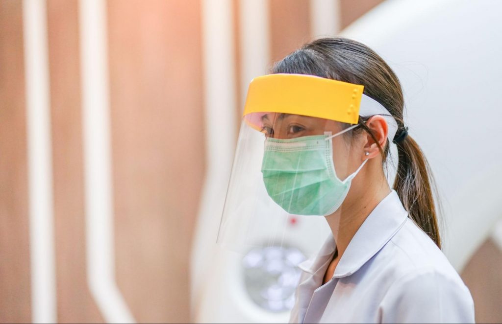 Female doctor wear PPE to show the shift in the medical industry and the future of healthcare