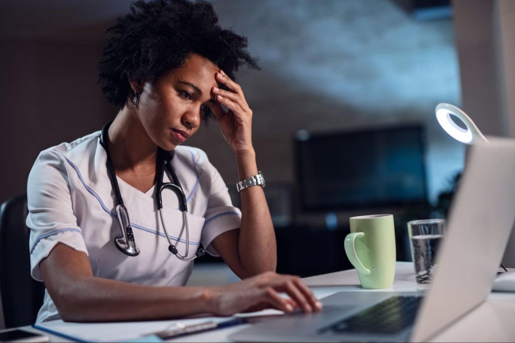 a stressed out nurse to represent Burnout in the Healthcare Industry